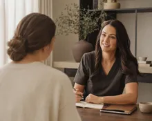 A practitioner talking with a woman about her health