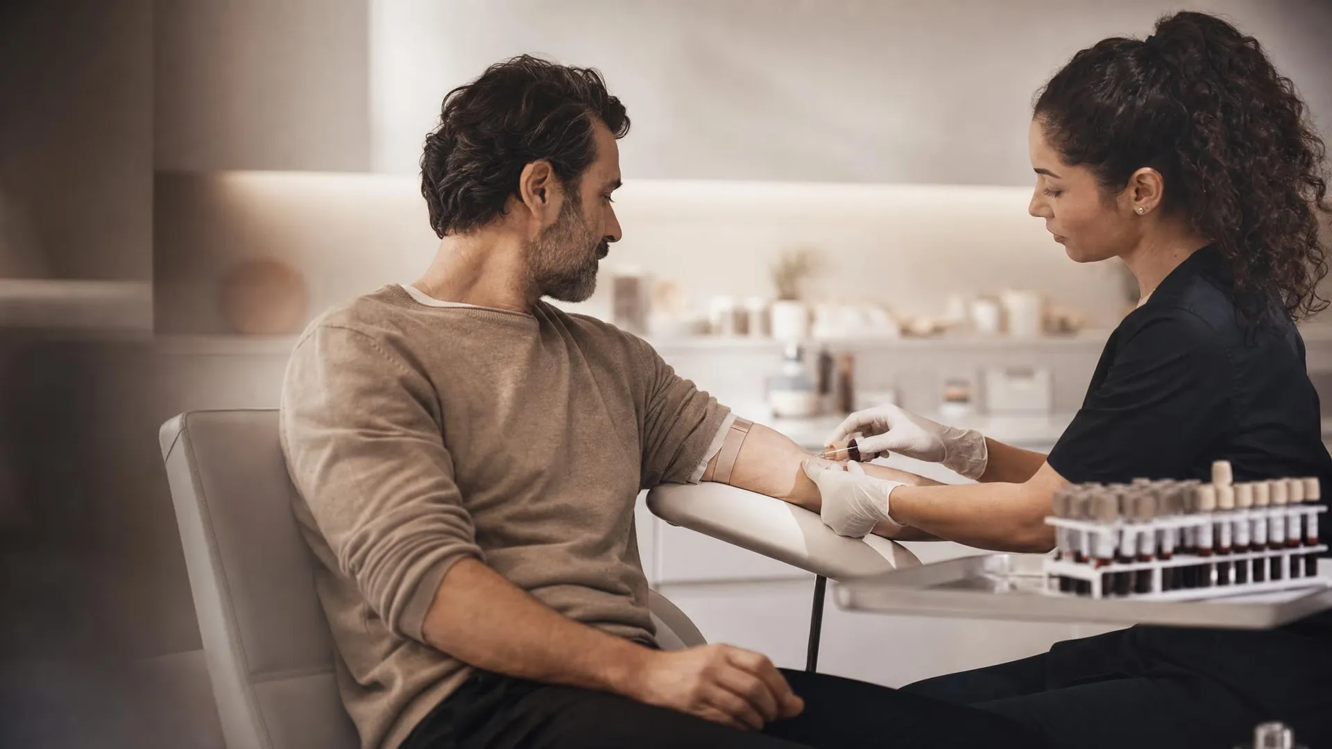 A patient having a blood sample taken at a clinic